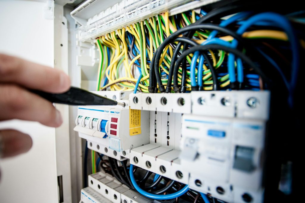 pexels-photo-257736-257736 Electrician Fixing an Opened Switchboard